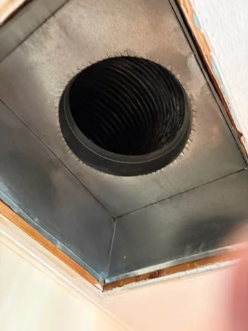 Soot on a ceiling plenum takeoff collar, Yaphank, NY